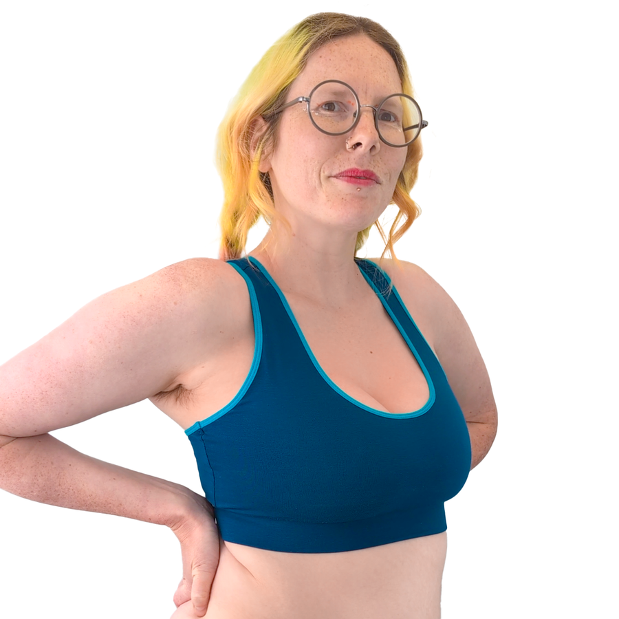 Jen wearing a Petrol Blue cotton bralette in the scoop neck Mighty style with lagoon blue piping.